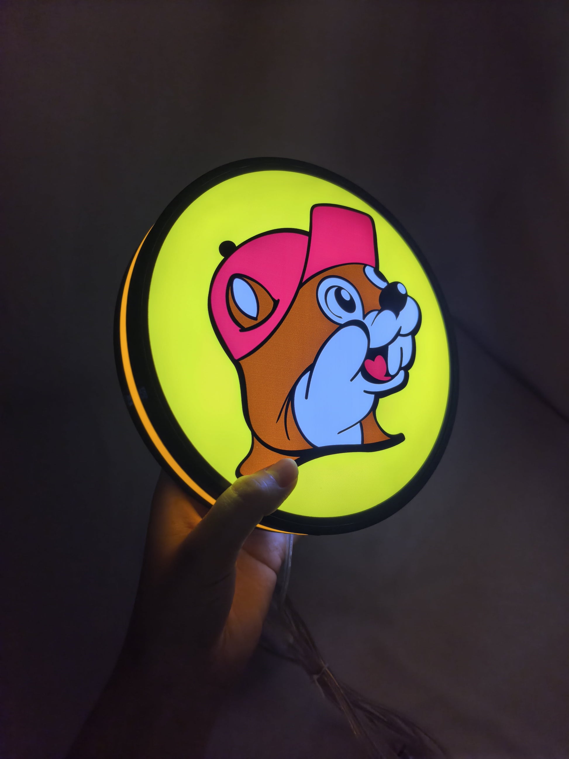 Illuminated handheld size reference of Buc Ee S Beaver Mascot Illuminated Sign in 20cm, unique wall art for desk and room decor