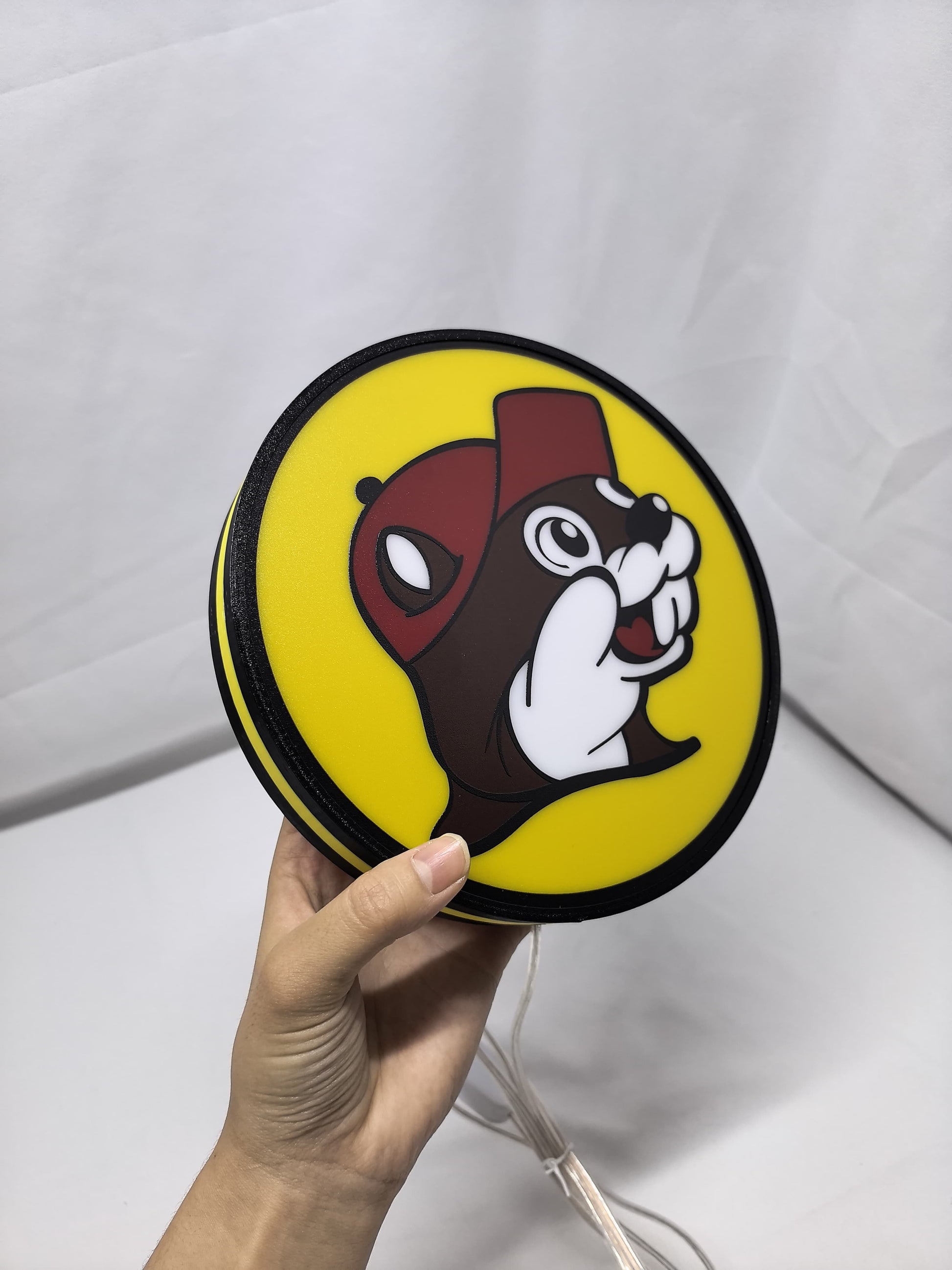 Unlit handheld size reference of Buc Ee S Beaver Mascot 3D LED Sign in 20cm, unique wall art for desk and room decor
