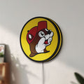 Unlit Buc-ee's Beaver Mascot LED lightbox mounted on a wall in daylight
