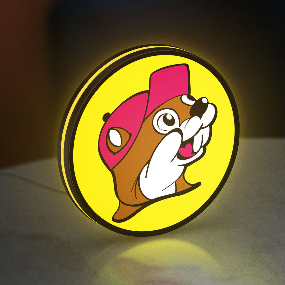 Buc-ee's Beaver Mascot LED lightbox hanging on a wall with yellow glow