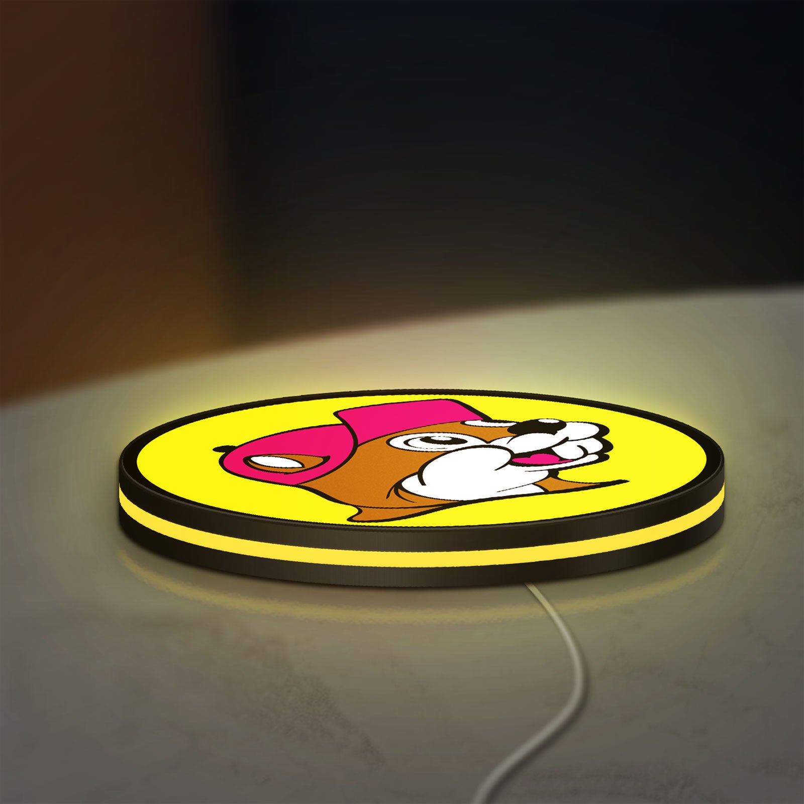 Buc-ee's Beaver Mascot LED lightbox lying flat on a desk with yellow glow
