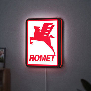Romet Sign LED lightbox hanging on a wall with red glow