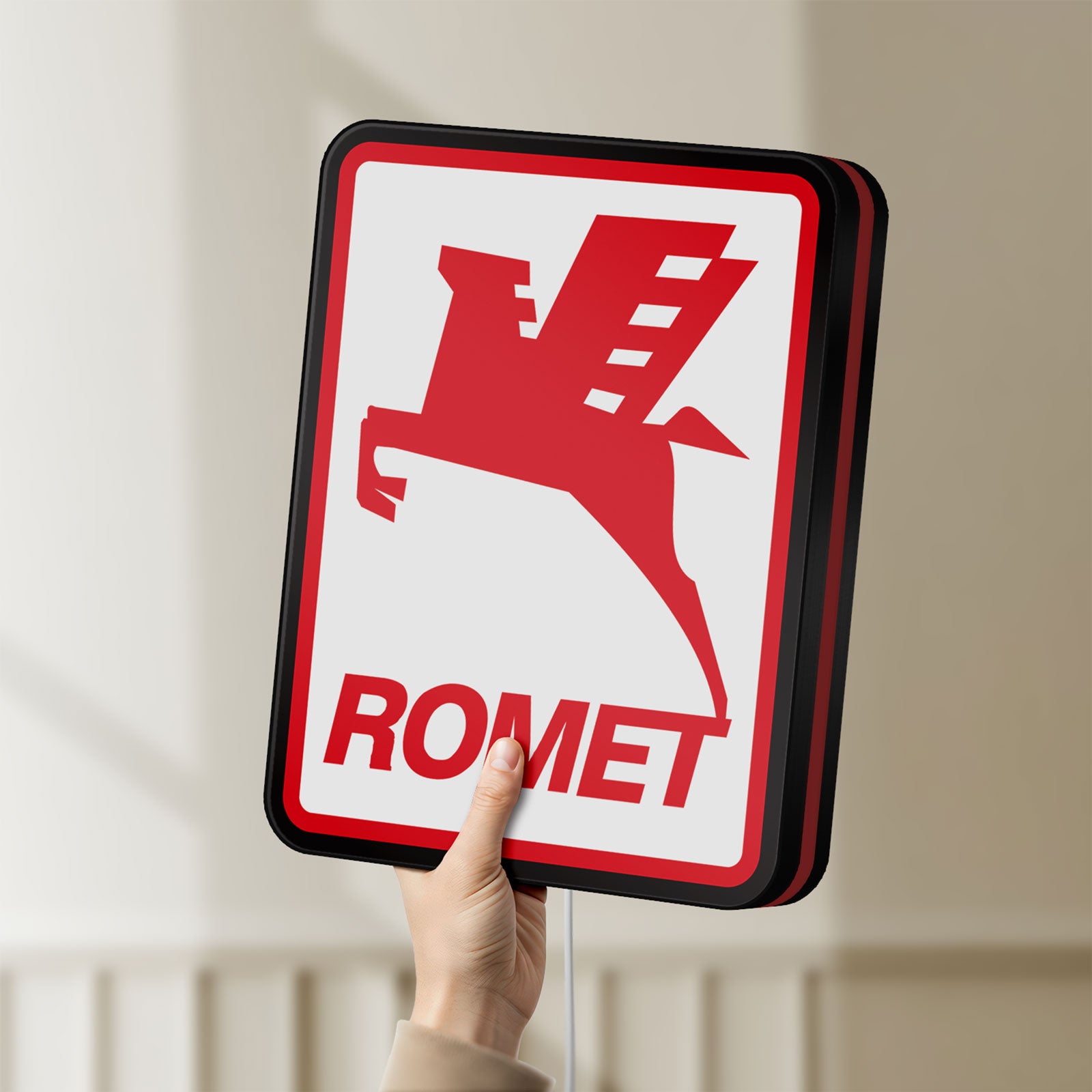 Unlit Romet Sign LED lightbox held by hand to show size and details
