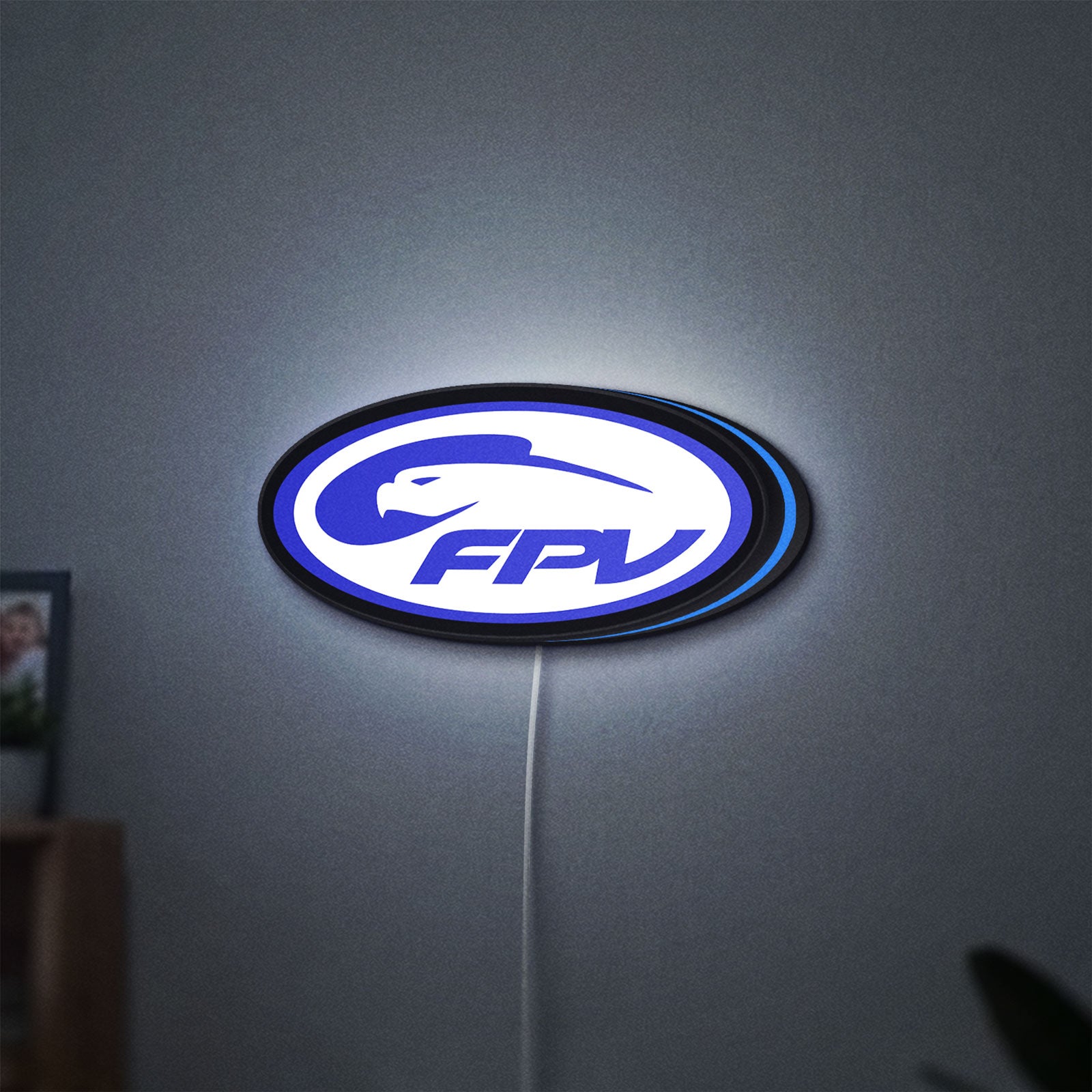FPV Drone Pilot Gift LED lightbox hanging on a wall with blue glow