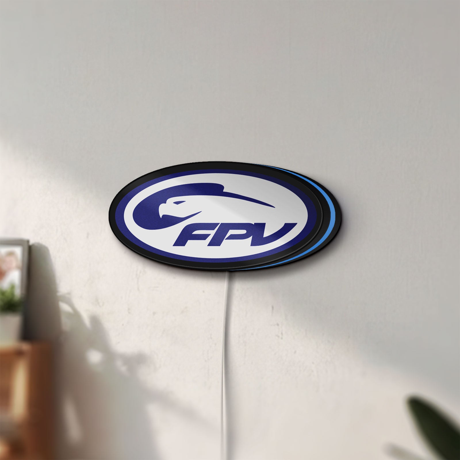 Unlit FPV Drone Pilot Gift LED lightbox mounted on a wall in daylight