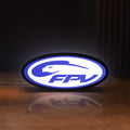 Front view of FPV Drone Pilot Gift LED lightbox sign glowing on a wooden desk