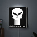 Corvette Skull LED lightbox hanging on a wall with white glow