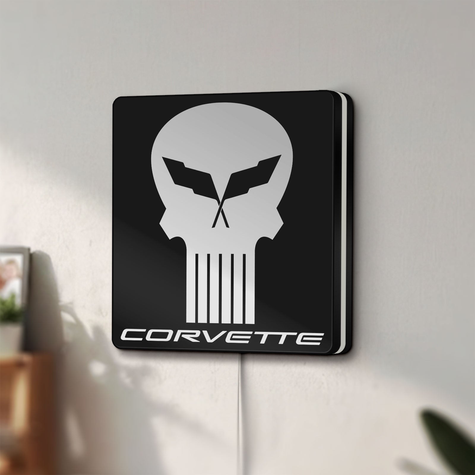 Unlit Corvette Skull LED lightbox mounted on a wall in daylight