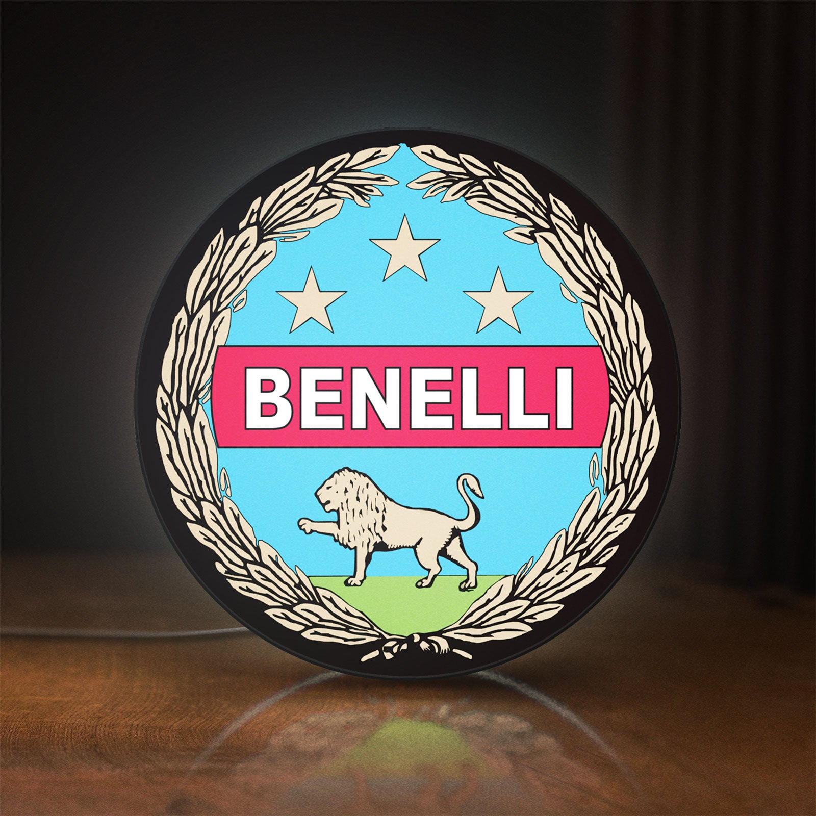 Front view of Benelli Motorcycle LED lightbox sign glowing on a wooden desk