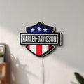 Unlit Harley Shield Motorcycle LED lightbox mounted on a wall in daylight