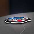 Harley Shield Motorcycle LED lightbox lying flat on a desk with white glow