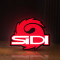 Front view of Sidi Cycling LED lightbox sign glowing on a wooden desk
