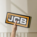 Unlit JCB Heavy Equipment LED lightbox held by hand to show size and details