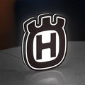 Husqvarna LED lightbox standing on a desk from an angled side view with white glow