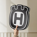 Unlit Husqvarna LED lightbox held by hand to show size and details