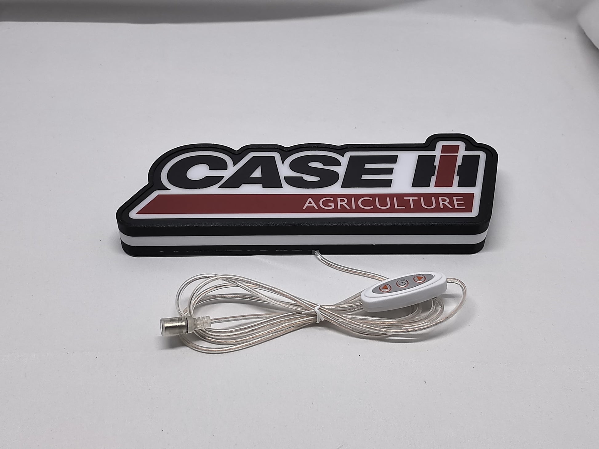 Unlit flat lay angled details of Case Ih Agriculture 3D LED Sign in 30cm, unique wall art for desk and room decor