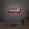 Case IH Agriculture LED lightbox hanging on a room wall with soft white light