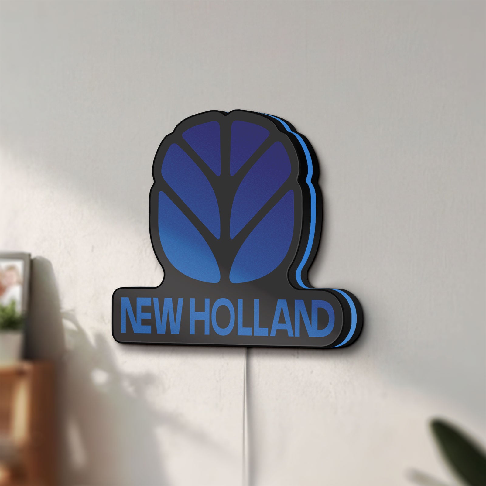 Unlit New Holland LED lightbox mounted on a wall in daylight