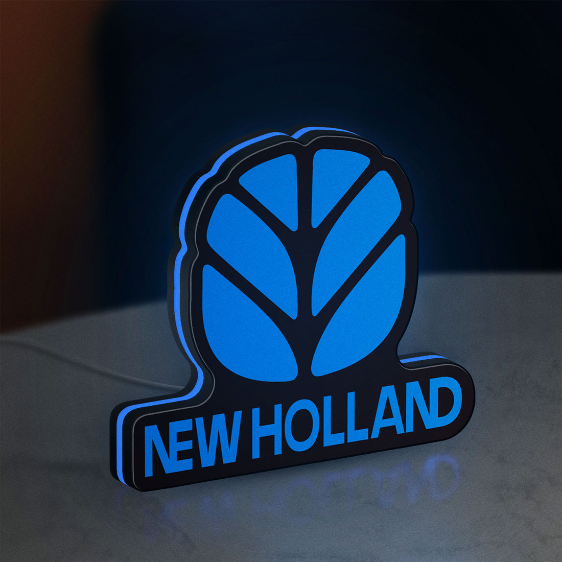New Holland LED lightbox hanging on a wall with blue glow