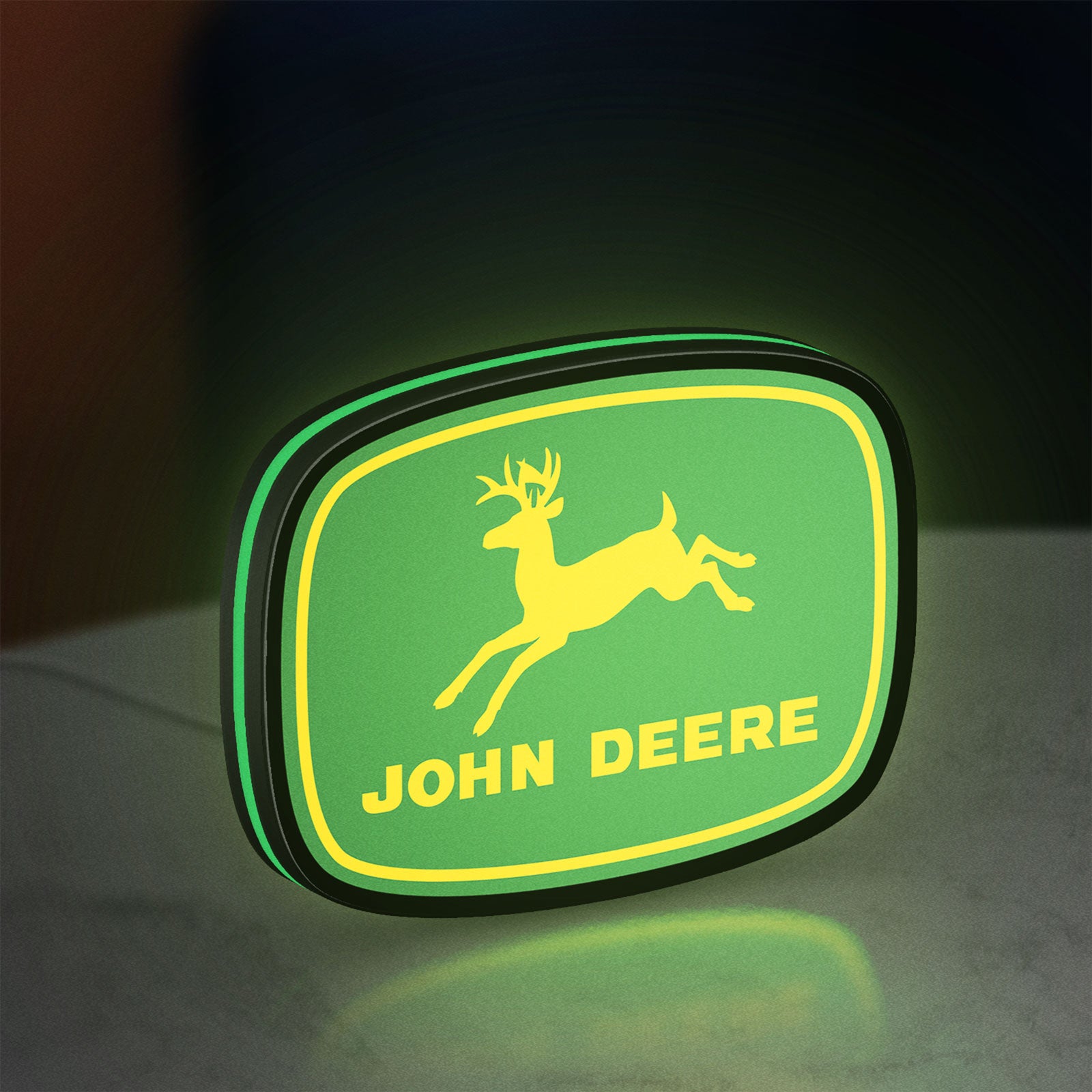 John Deere LED lightbox standing on a desk from an angled side view with green glow