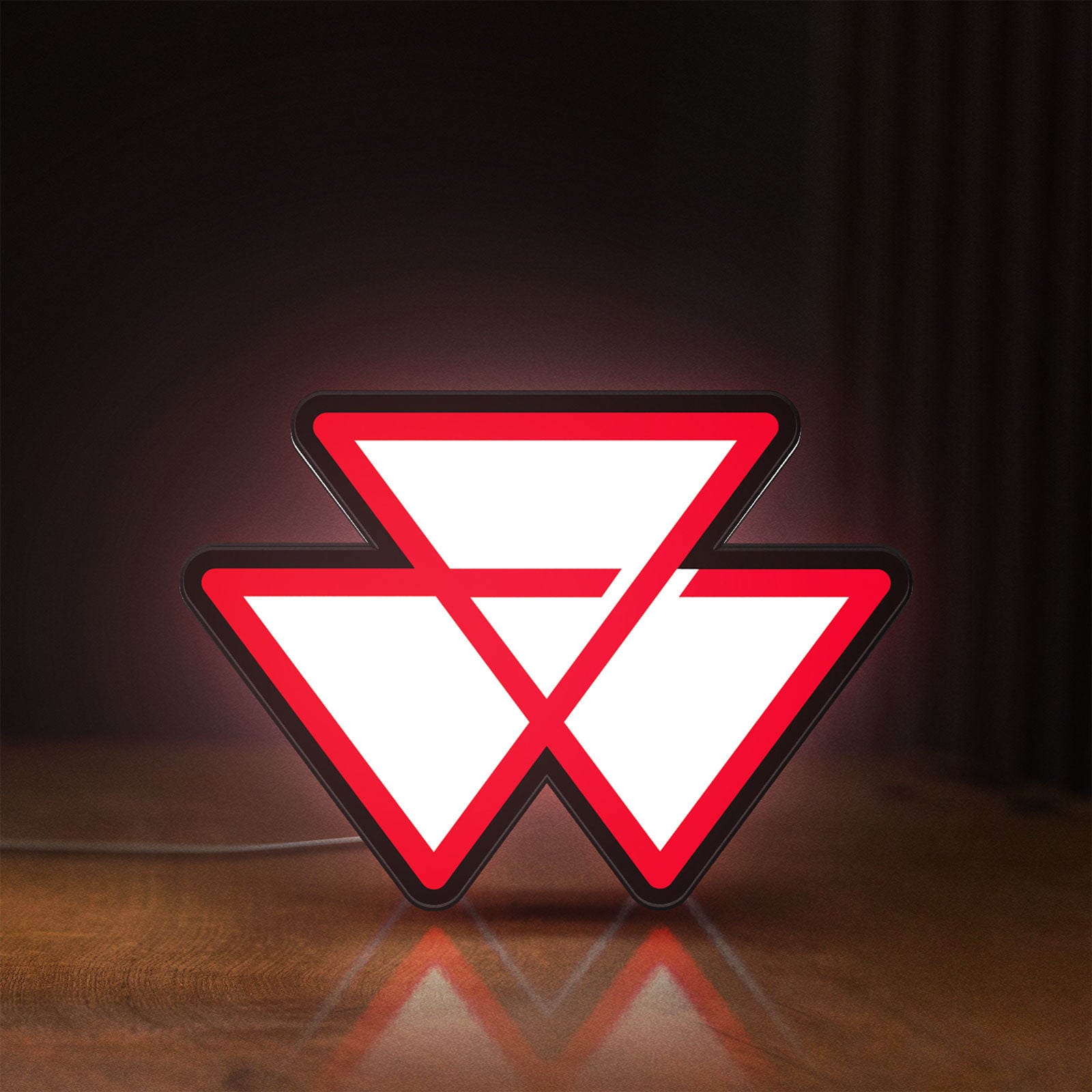 Front view of Massey Ferguson LED lightbox sign glowing on a wooden desk