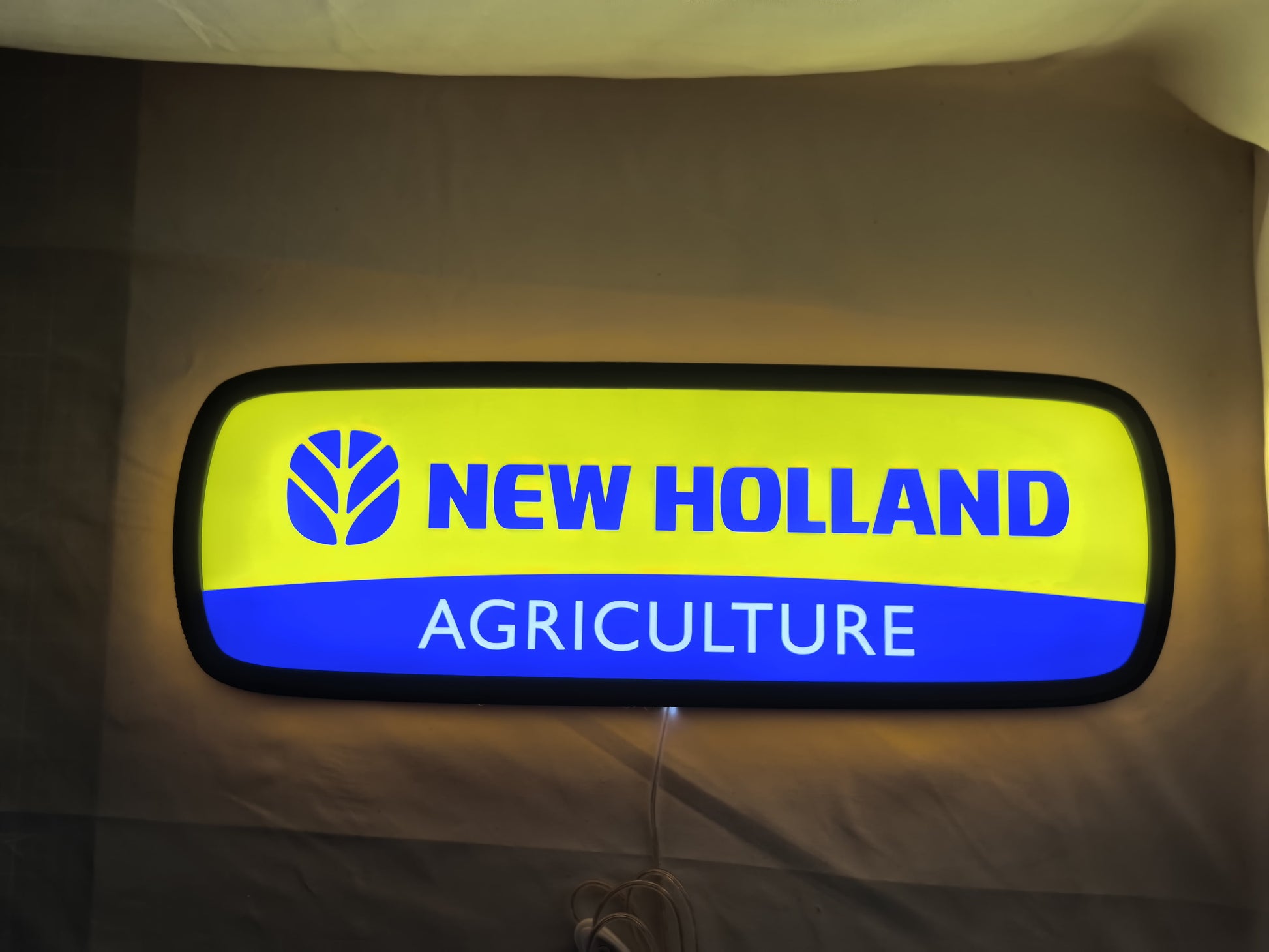 New Holland Agriculture LED Sign (50cm) - Illuminated flat lay front view, perfect for garage and man cave decor