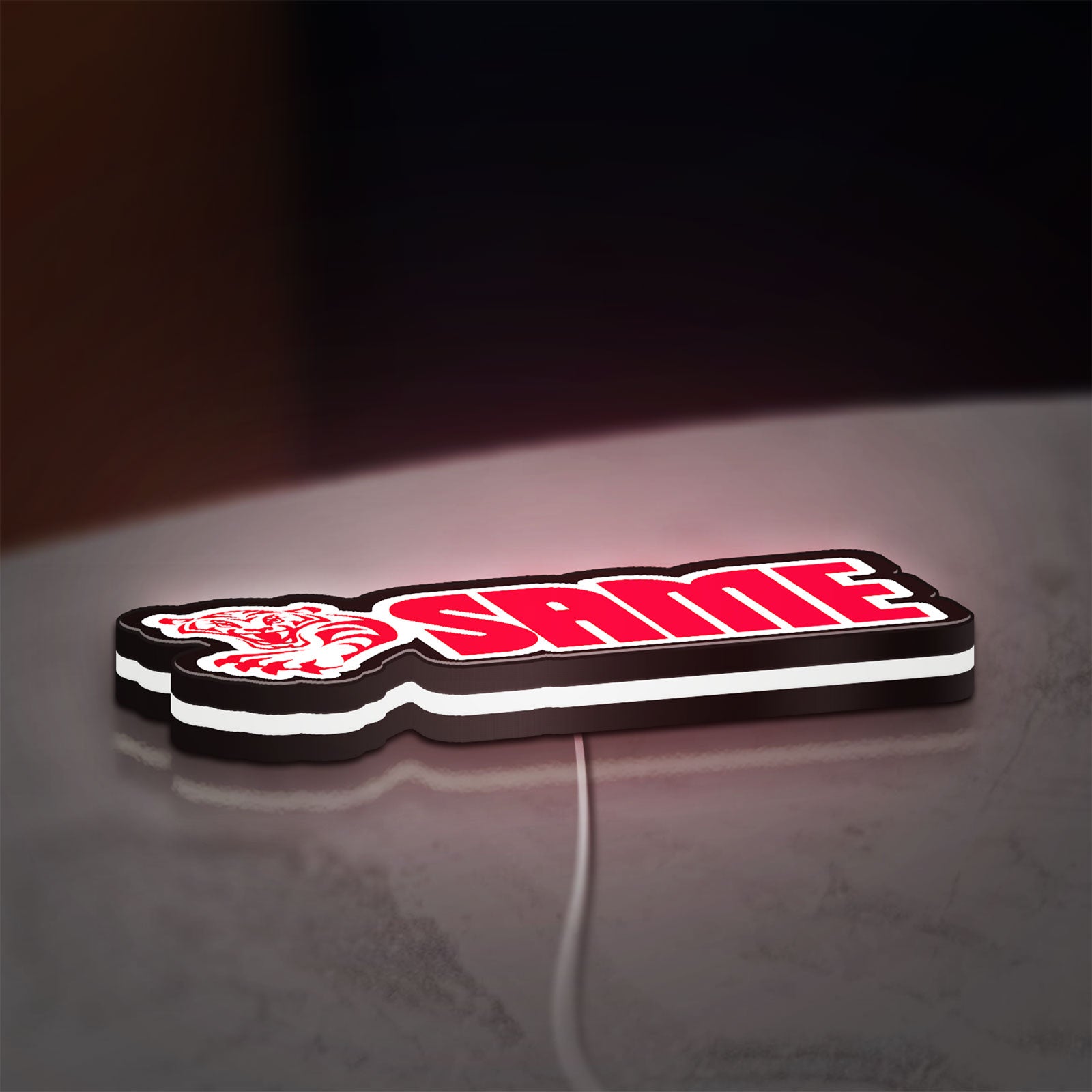 SAME LED lightbox lying flat on a desk with white glow