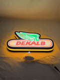 Illuminated flat lay angled view of Dekalb Illuminated Sign in 30cm, unique wall art for desk and room decor