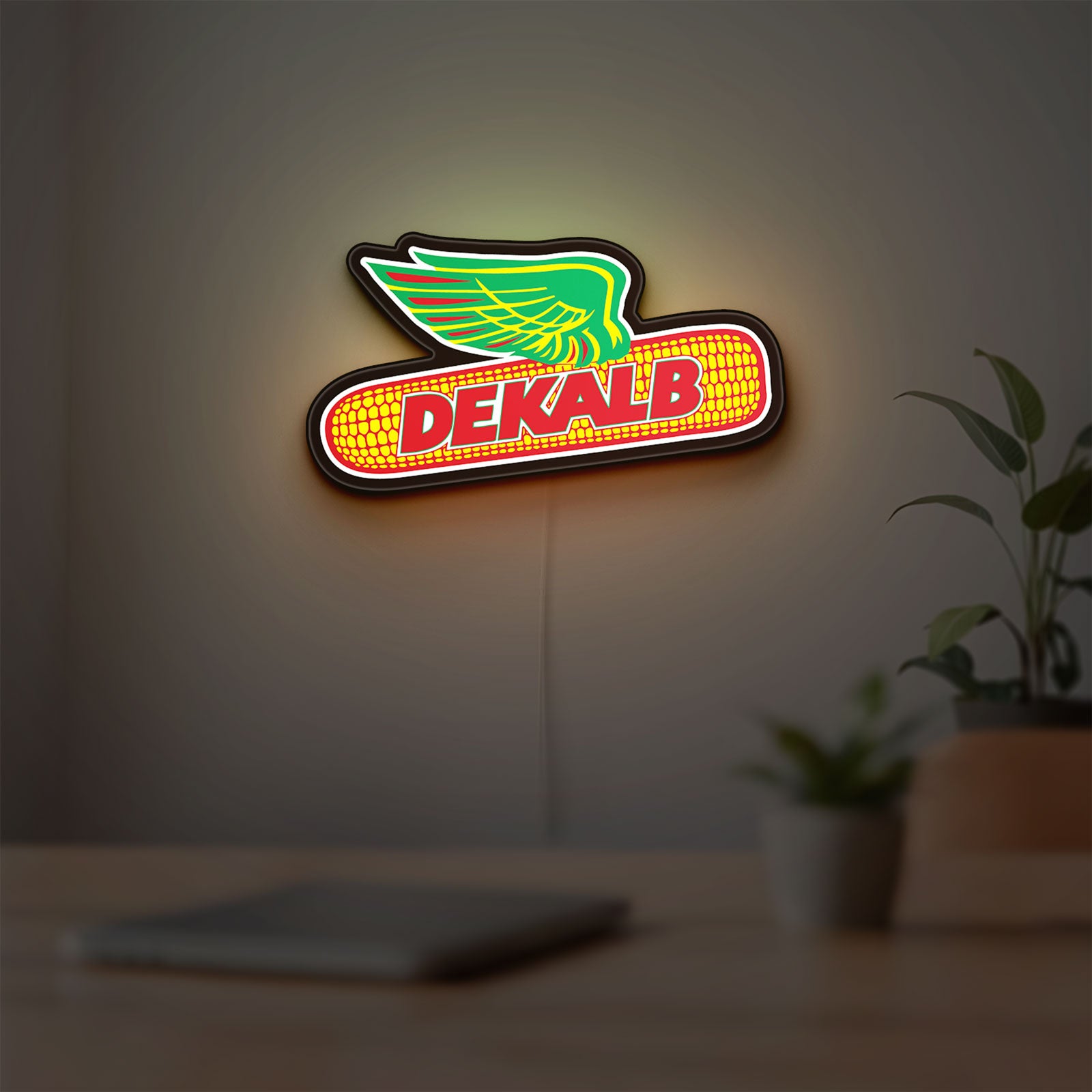 Dekalb LED lightbox hanging on a room wall with soft yellow light
