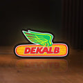 Front view of Dekalb LED lightbox sign glowing on a wooden desk
