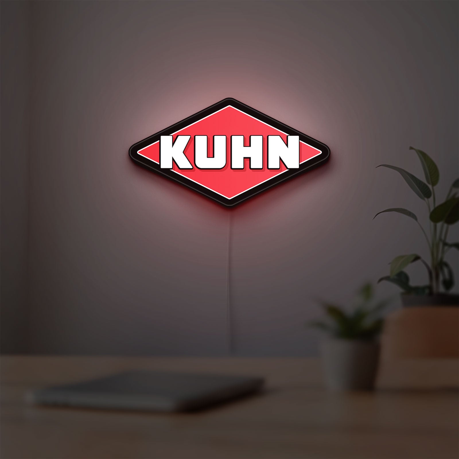 Kuhn LED lightbox hanging on a room wall with soft red light