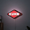 Kuhn LED lightbox hanging on a wall with red glow