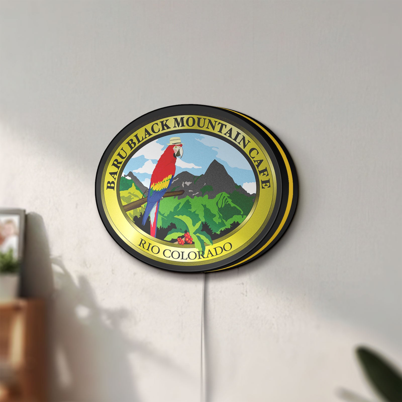 Unlit Baru Black Mountain Cafe LED lightbox mounted on a wall in daylight
