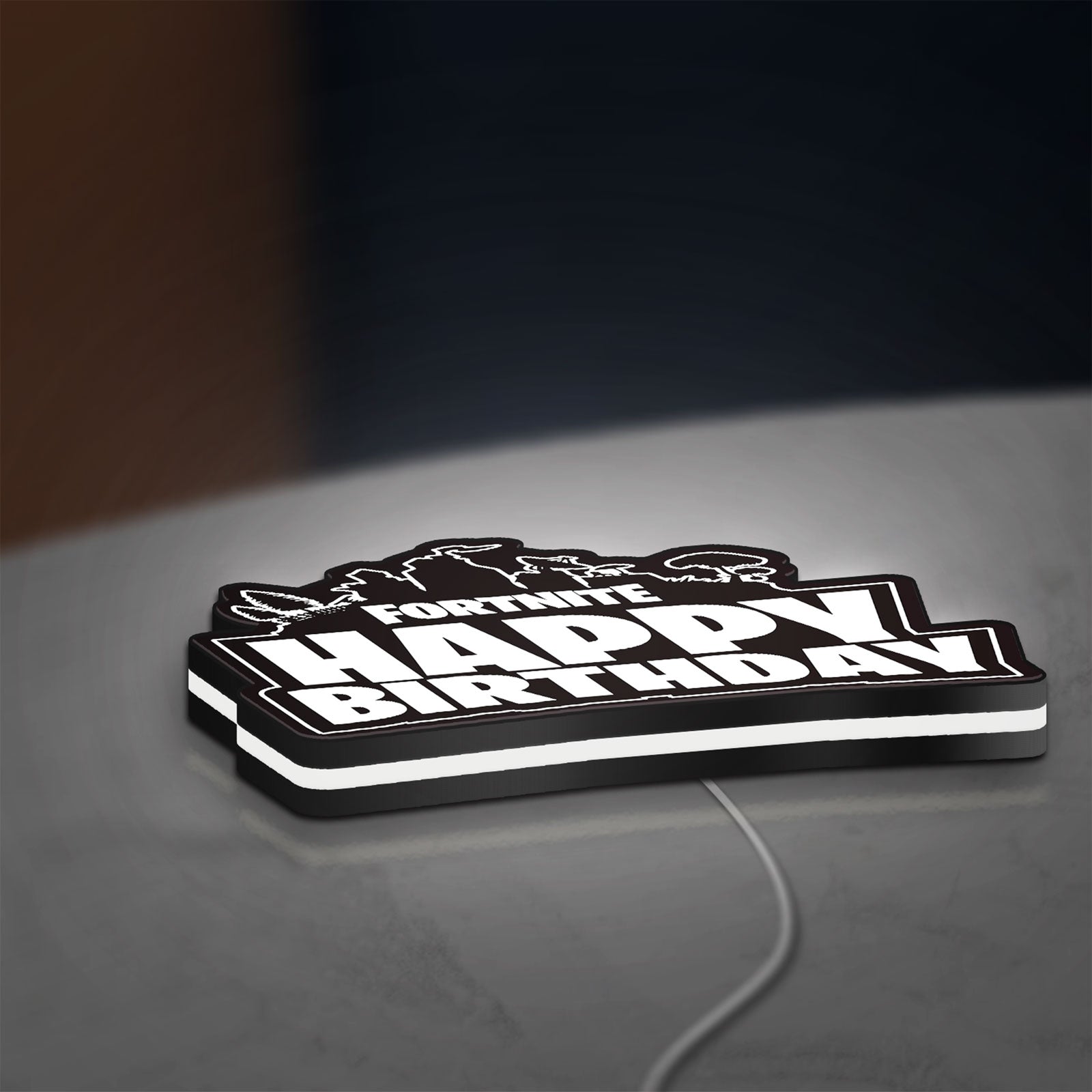 Fortnite LED lightbox lying flat on a desk with white glow