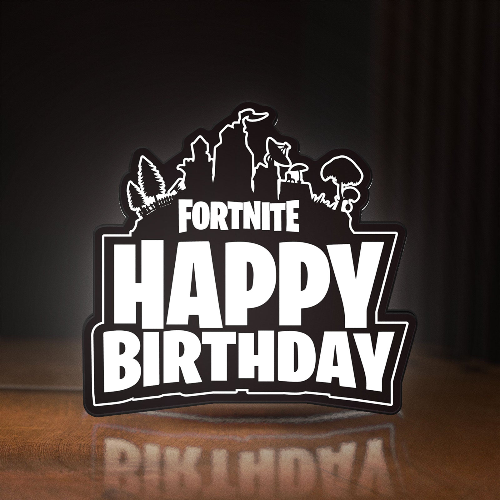 Front view of Fortnite LED lightbox sign glowing on a wooden desk