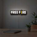 Free Fire LED lightbox hanging on a room wall with soft white light