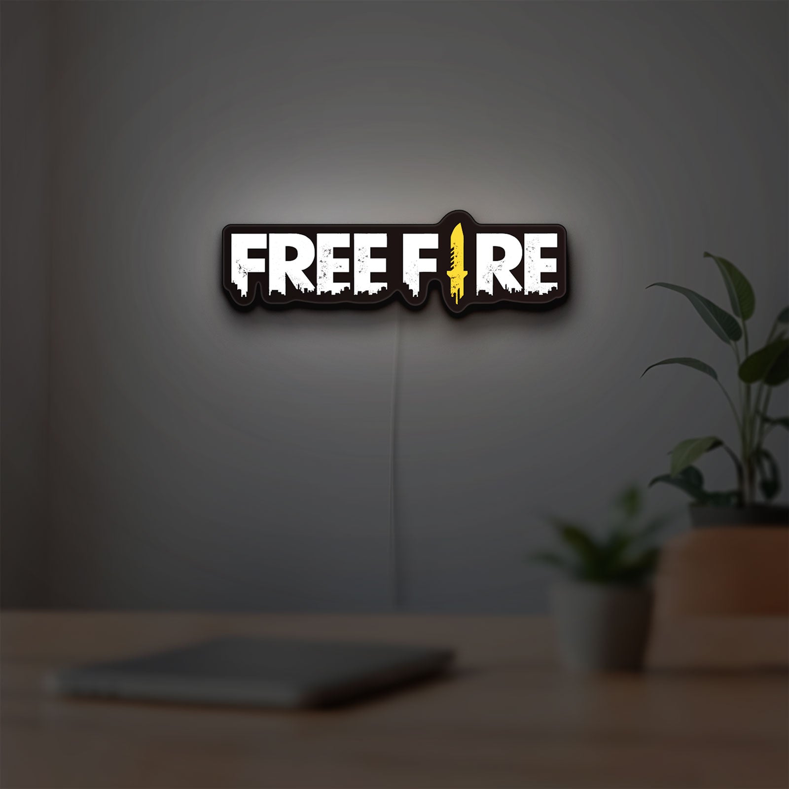 Free Fire LED lightbox hanging on a room wall with soft white light