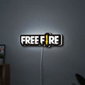 Free Fire LED lightbox hanging on a wall with white glow