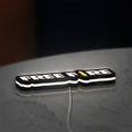 Free Fire LED lightbox lying flat on a desk with white glow