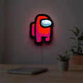 Among Us LED lightbox hanging on a room wall with soft red light
