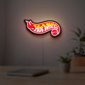 Hot Wheels Flame Racing Car LED lightbox hanging on a room wall with soft yellow light
