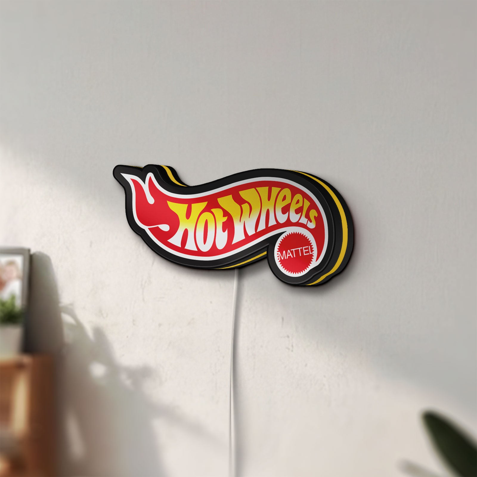 Unlit Hot Wheels Flame Racing Car LED lightbox mounted on a wall in daylight