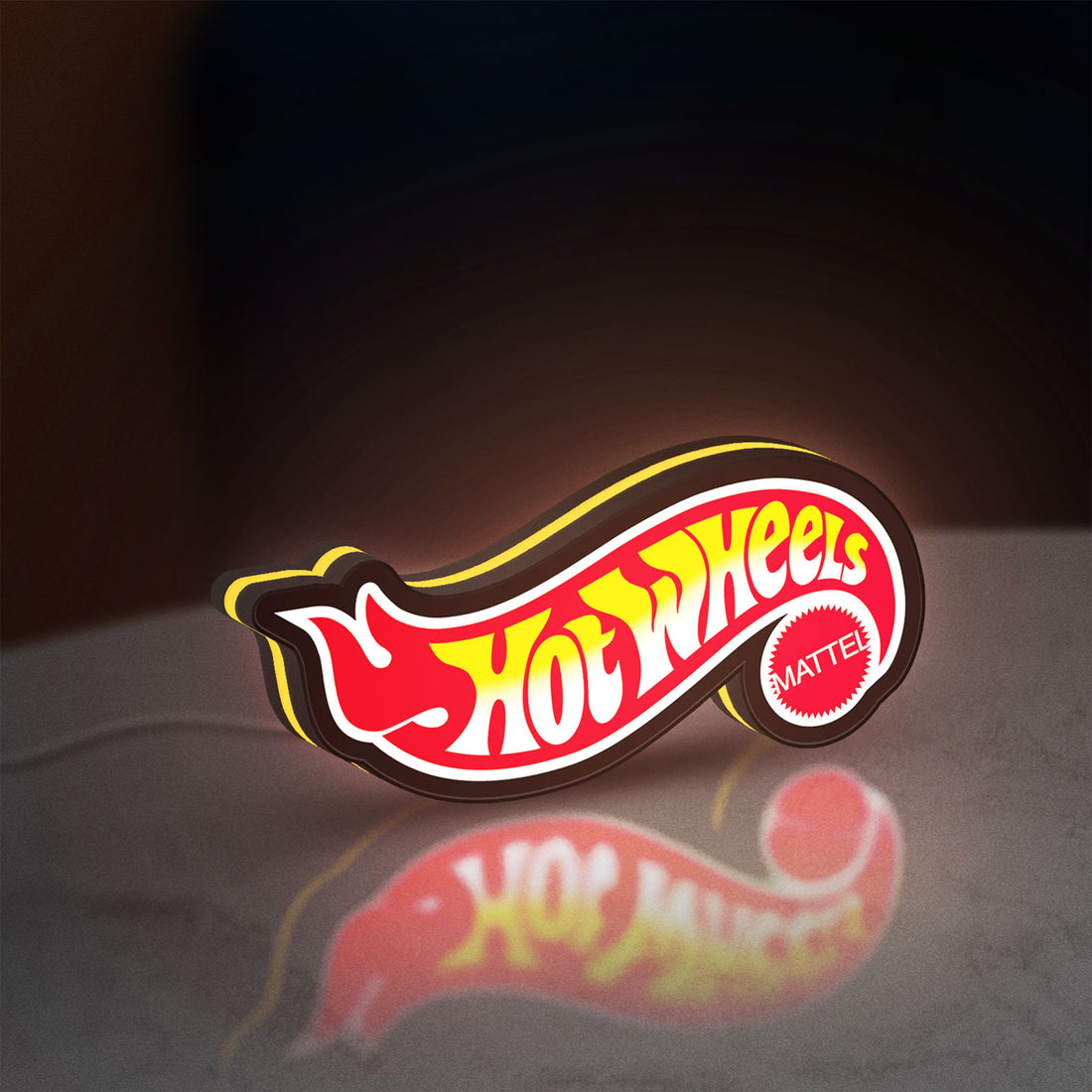 Hot Wheels Flame Racing Car LED lightbox hanging on a wall with yellow glow