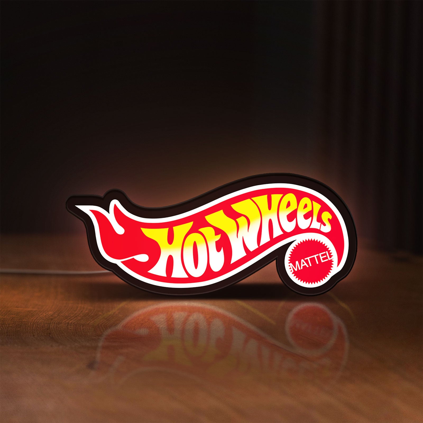 Front view of Hot Wheels Flame Racing Car LED lightbox sign glowing on a wooden desk