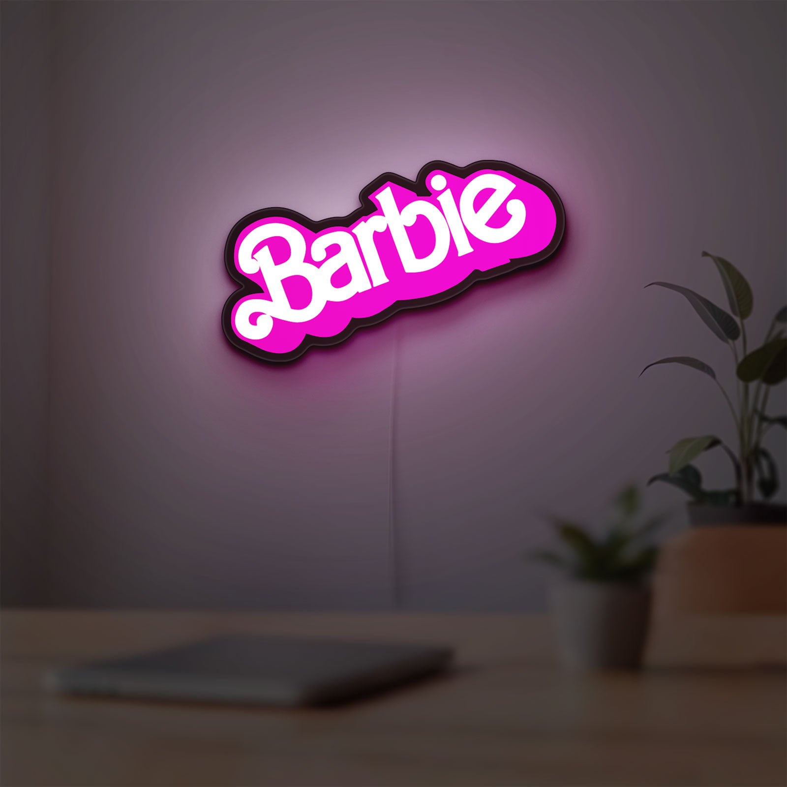 Barbie LED lightbox hanging on a room wall with soft pink light