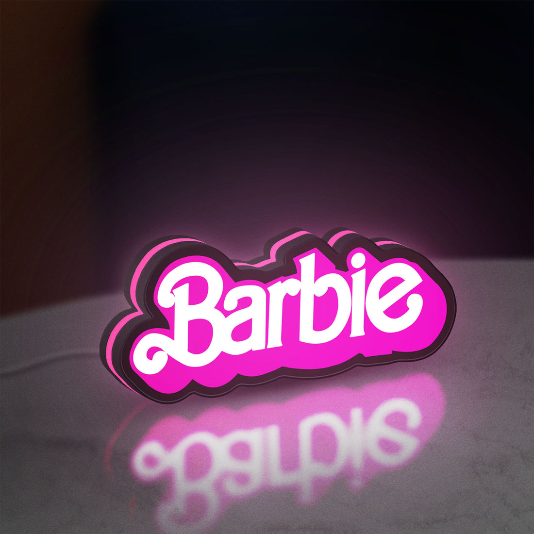 Barbie LED lightbox hanging on a wall with pink glow