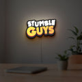 Stumble Guys LED lightbox hanging on a room wall with soft white light