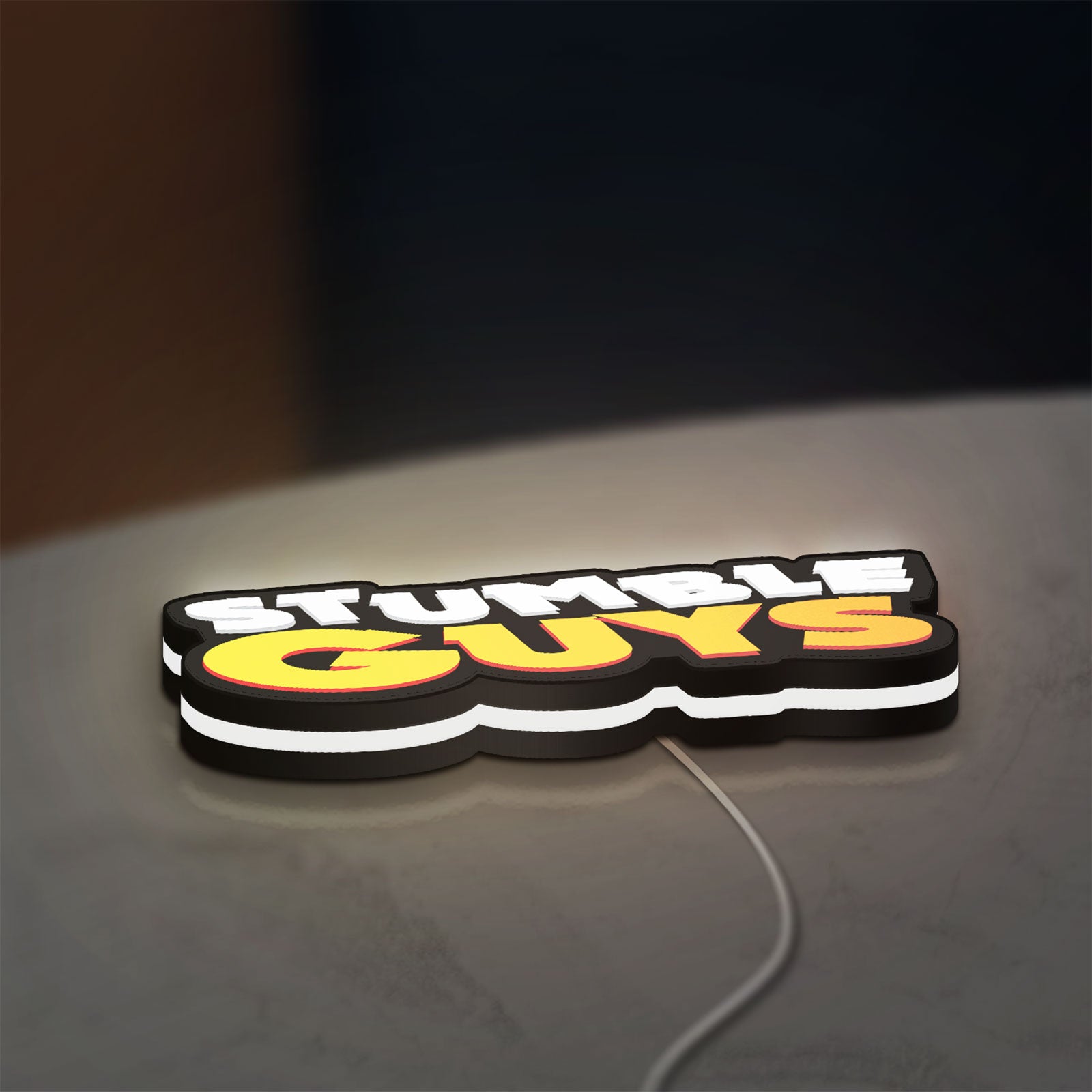 Stumble Guys LED lightbox lying flat on a desk with white glow