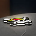One Piece Mugiwara Flag LED lightbox lying flat on a desk with white glow