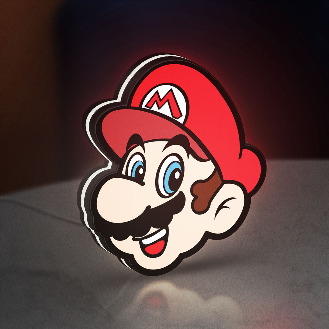 Super Mario LED lightbox hanging on a wall with white glow